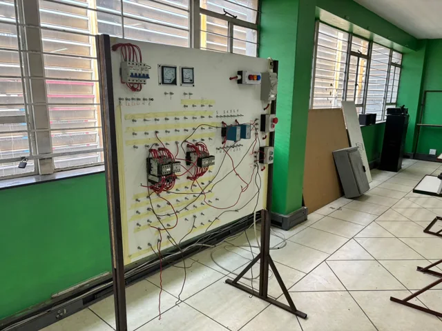 Electrical circuit training board beside a classroom window