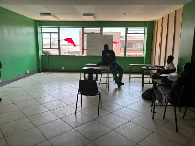 Students and lecturer during an electrical studies classroom discussion