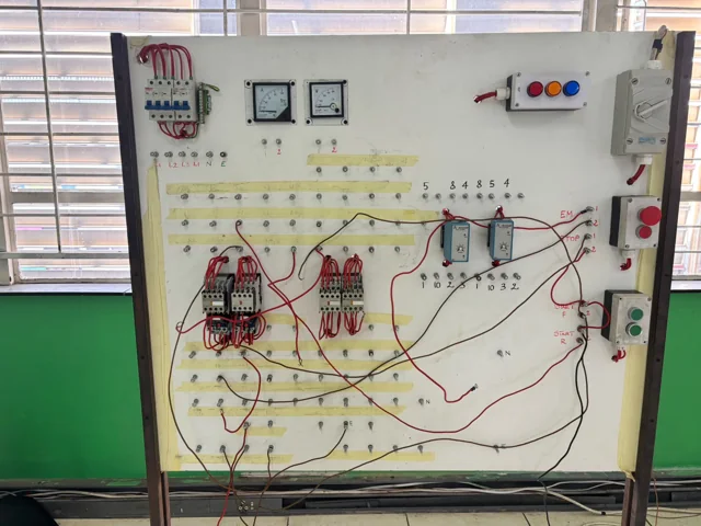 Switches, meters and wiring on an electrical training board