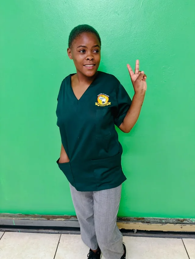 AIET student smiling in her campus uniform