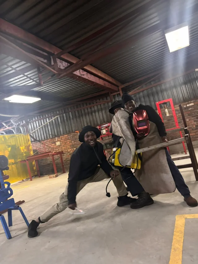 Boilermaking students posing together in the workshop